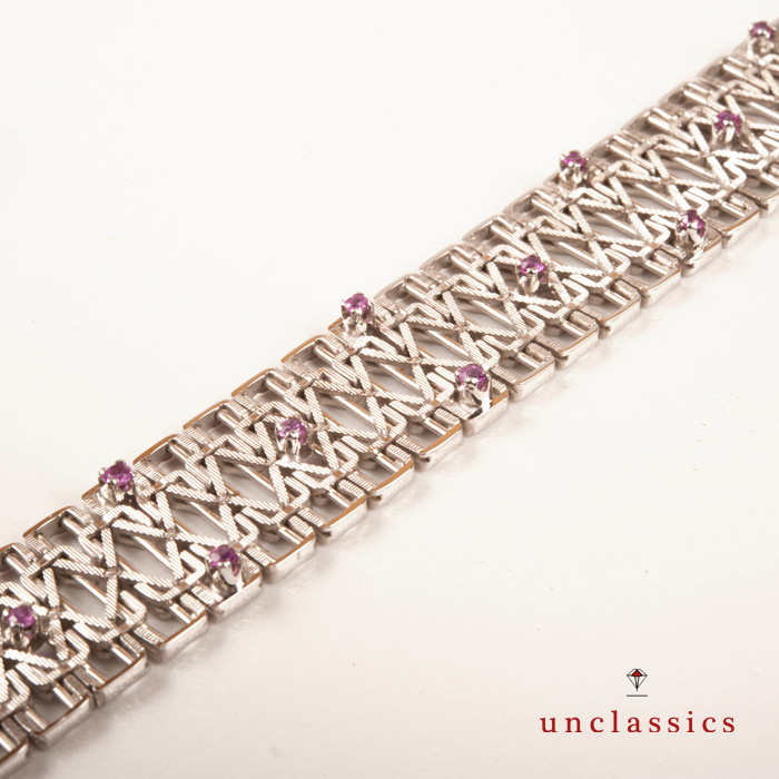 Unoaerre 70s bracelet in 18 Kt white gold and rubies.